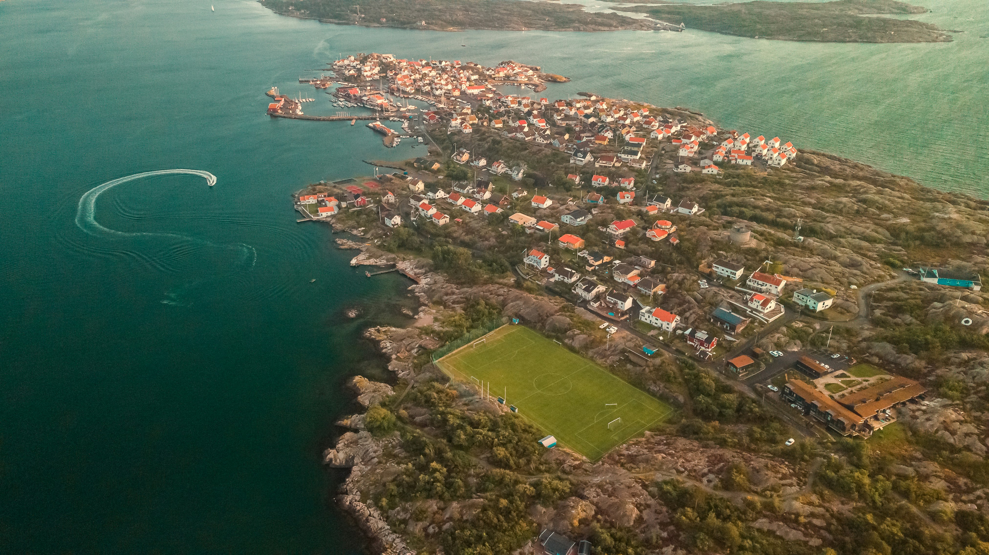 aerial view of city near body of water during daytime